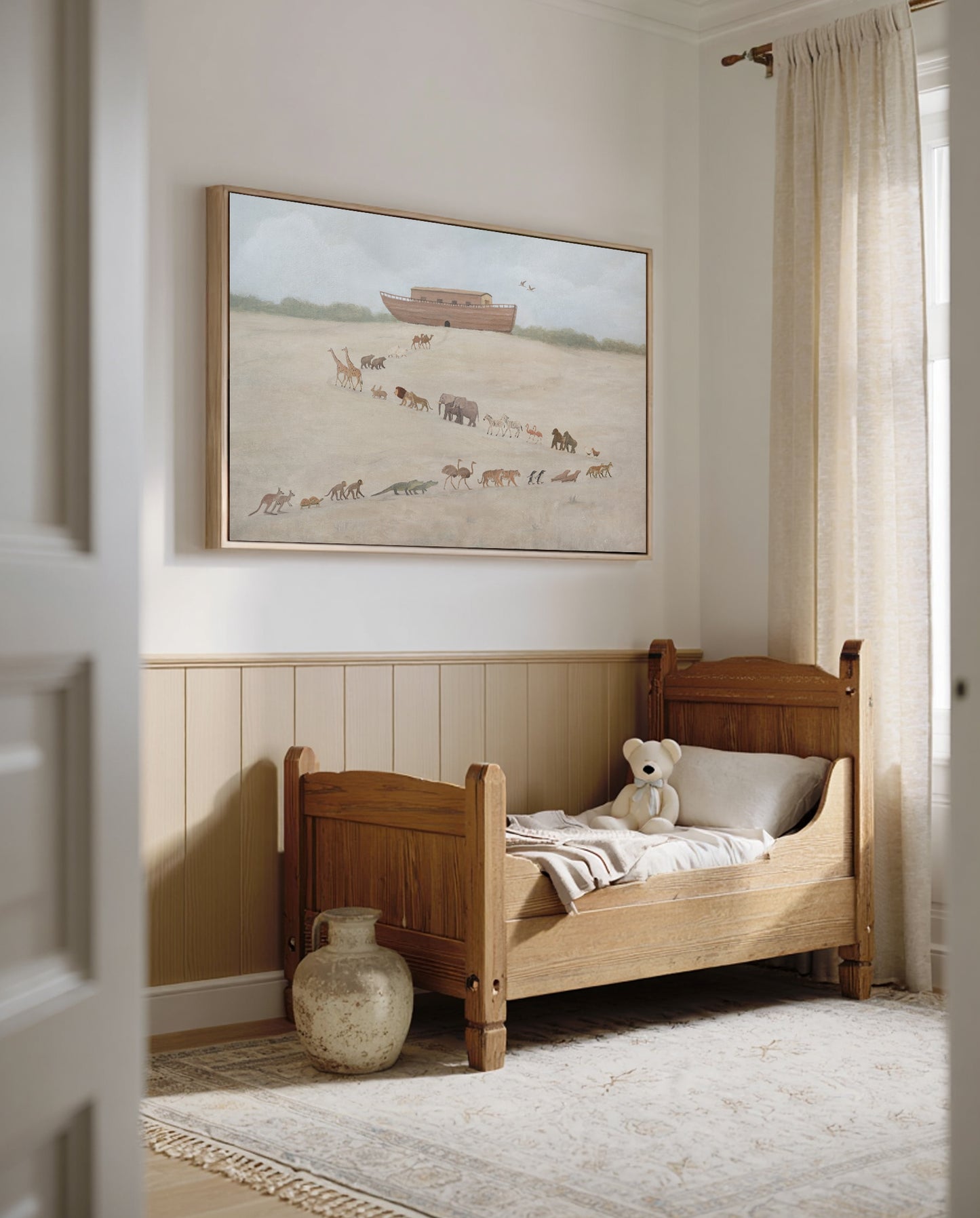 Neutral toddler room with the Noah's Ark canvas hung above a wooden bed and teddy bear
