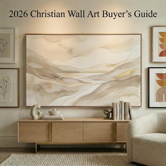 Modern living room with large neutral canvas wall art in warm beige and earth tones displayed above an oak console, surrounded by smaller gallery wall prints, showcasing the 2026 Christian Wall Art Buyer's Guide